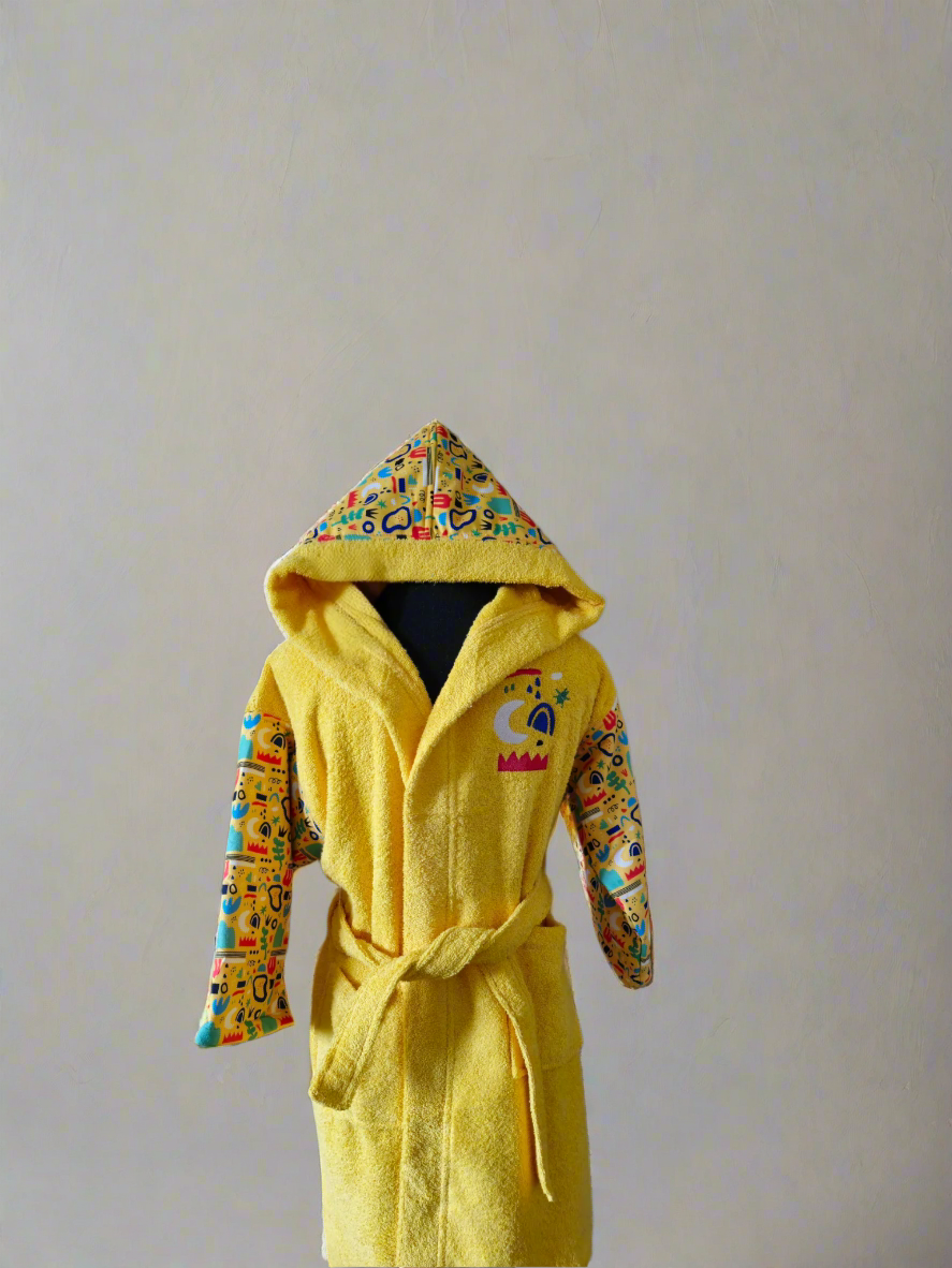 Yellow kids' bathrobe with nature-inspired print, made from soft and absorbent Turkish cotton for comfort and warmth