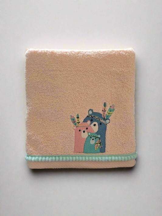 pink towel with embroidered design of two bear 