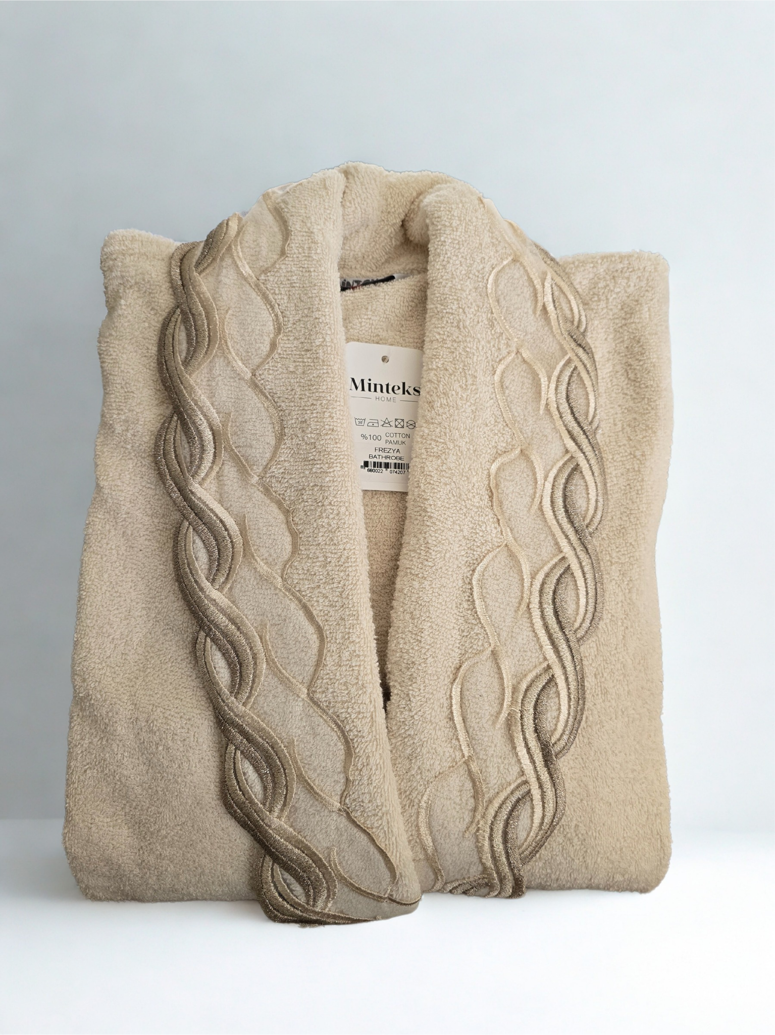 freyza cream cotton bathrobe and robe  folded, lightweight and breathable fabric