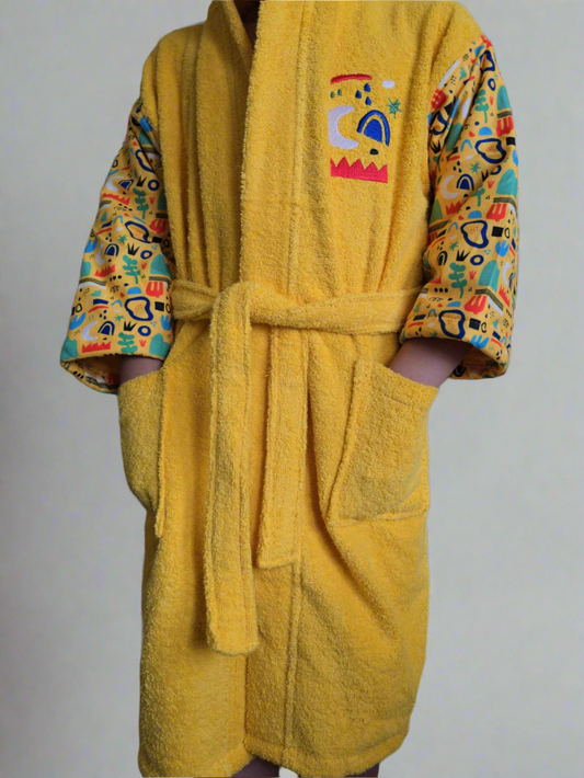 Yellow kids' bathrobe with nature-inspired print, made from soft and absorbent Turkish cotton for comfort and warmth


